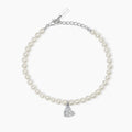 Bracciale in argento con perle conchiglia e cuore in pavé di zirconi