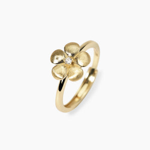 Anello con fiore in argento dorato